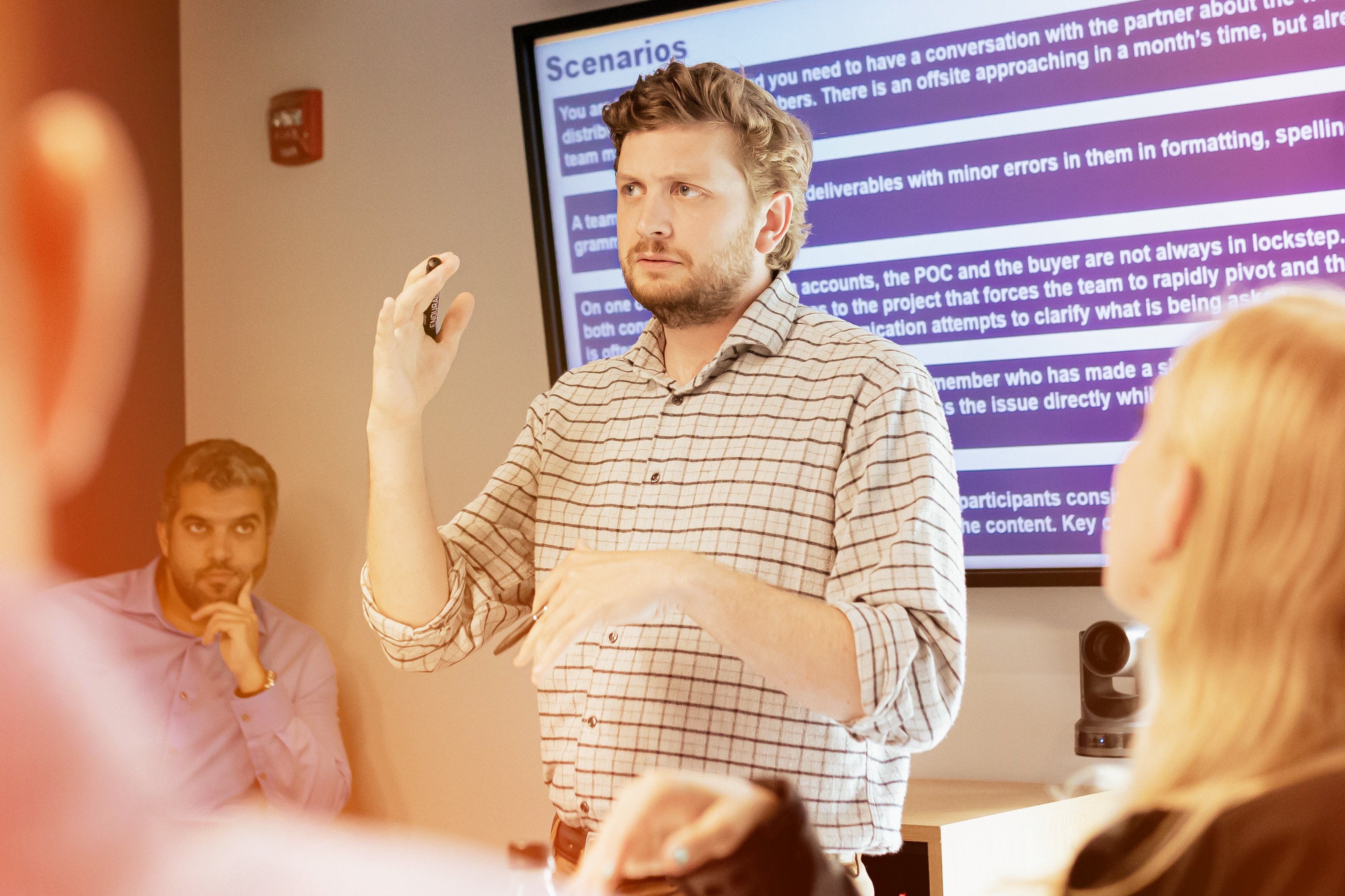 A man presenting to a group of people