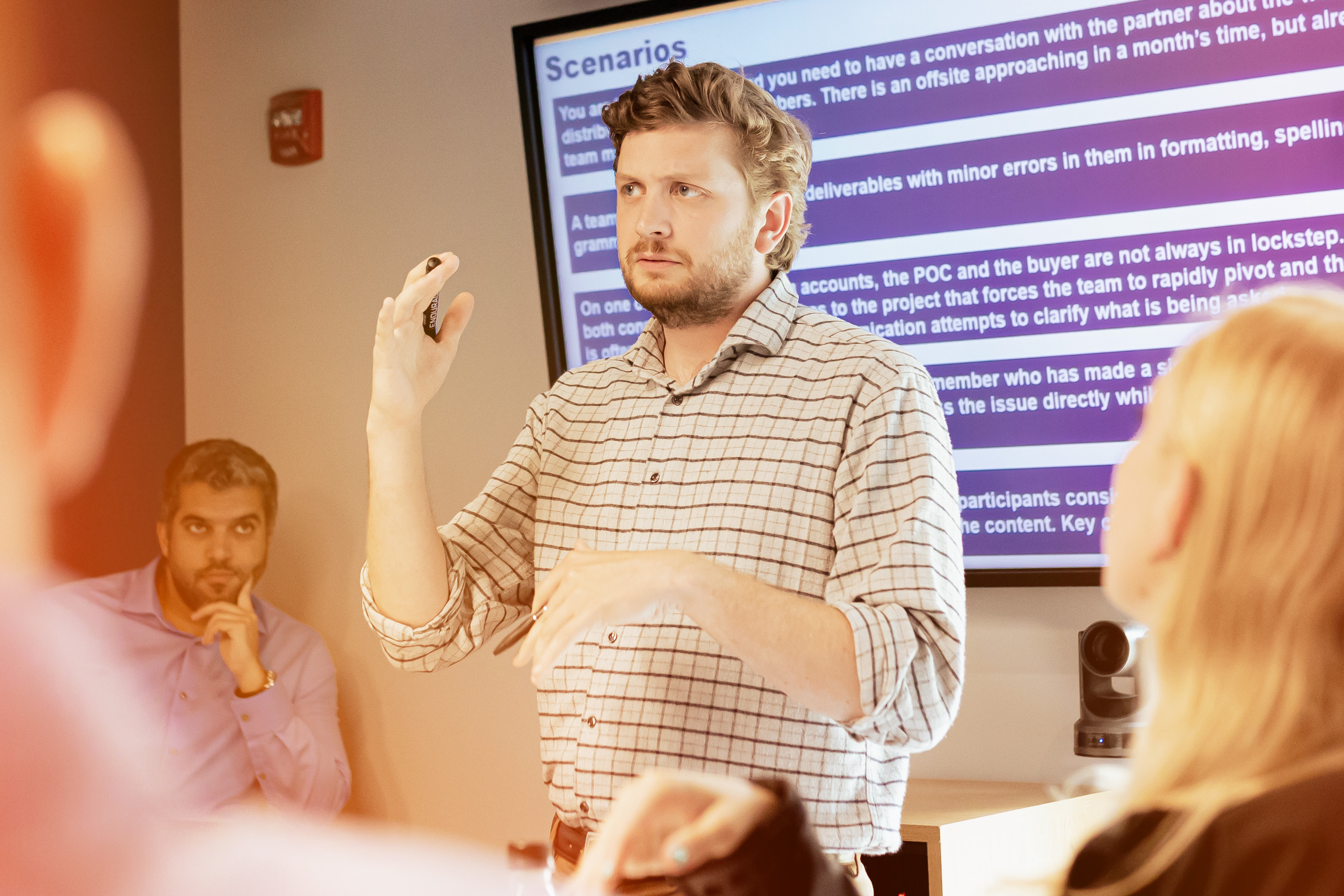 A man presenting to a group of people